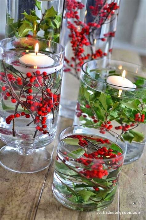 Clear Glass Vases Berries And Greenery And Floating Candles Christmas