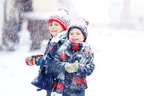 Happy Children Having Fun With Snow In Winter Stock Image