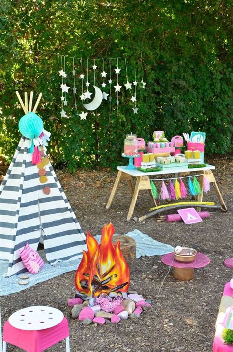 An Outdoor Birthday Party With Teepee Tent And Fire Pit