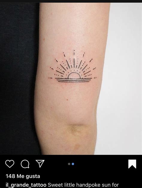 A Tattoo On The Arm Of A Woman With Sun And Clouds Above It In Black Ink