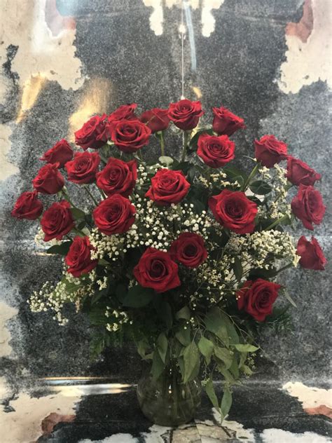2 Dozen Red Roses Long Stemmed Arranged And Dressed With Filler By