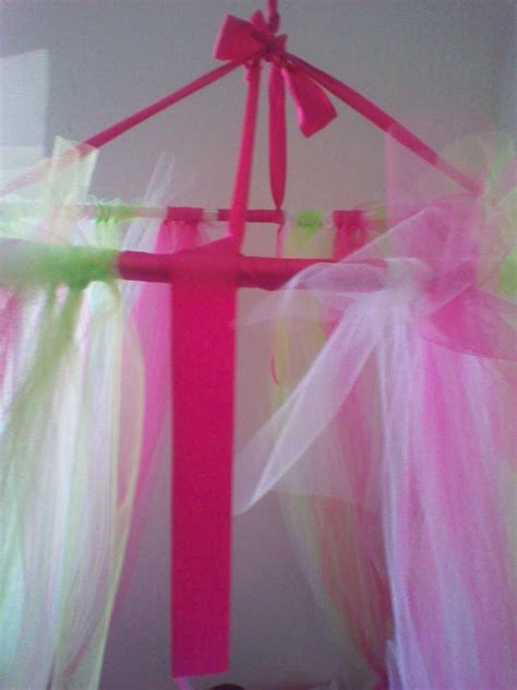 I may try to do that! Princess Dazzle: How to make a tulle bed canopy!