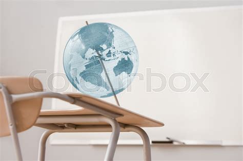 Globe And Desk In A Classroom Stock Image Colourbox