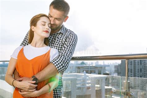 Nice Pleasant Man Hugging His Beloved Girlfriend Stock Image Image Of Date Roof 125405105