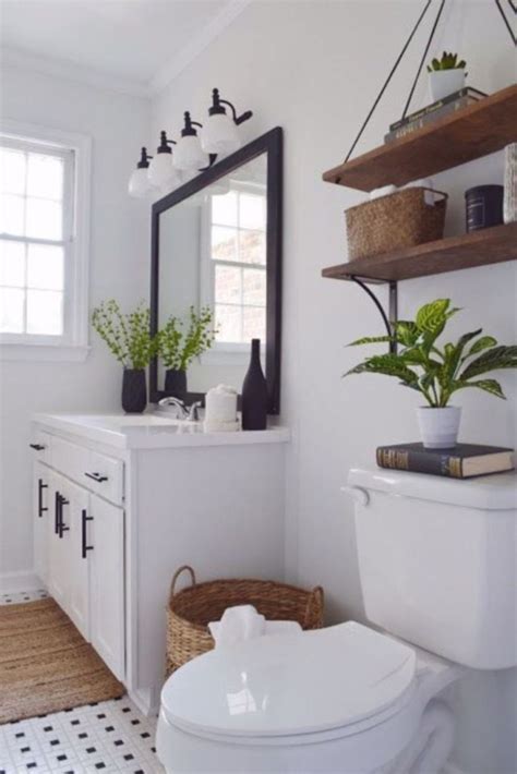 Blackened bronze fixtures helps this shower to feel integrated into the space. 17 Beautiful and Modern Farmhouse Bathroom Design Ideas ...