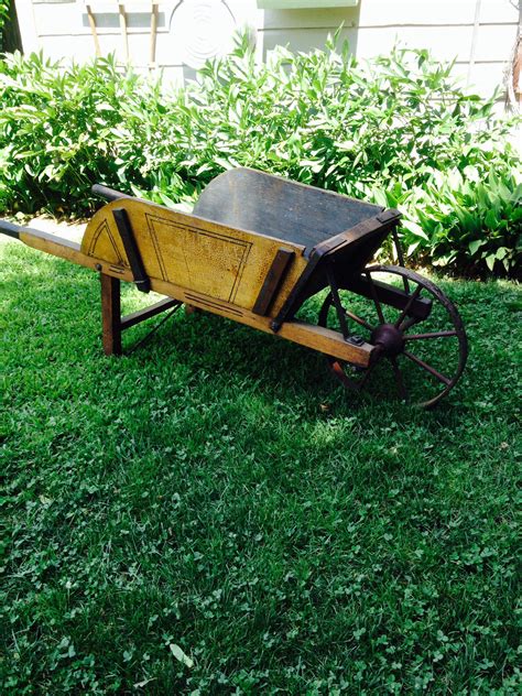 Old wooden wheelbarrow original mustard paint and stenciling | Wooden