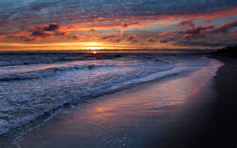 Sunset Over Waves Beach