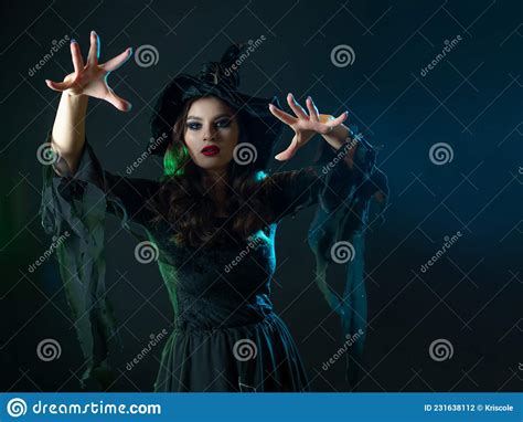 A Witch Creates Magic A Young Beautiful Brunette In A Pointed Hat