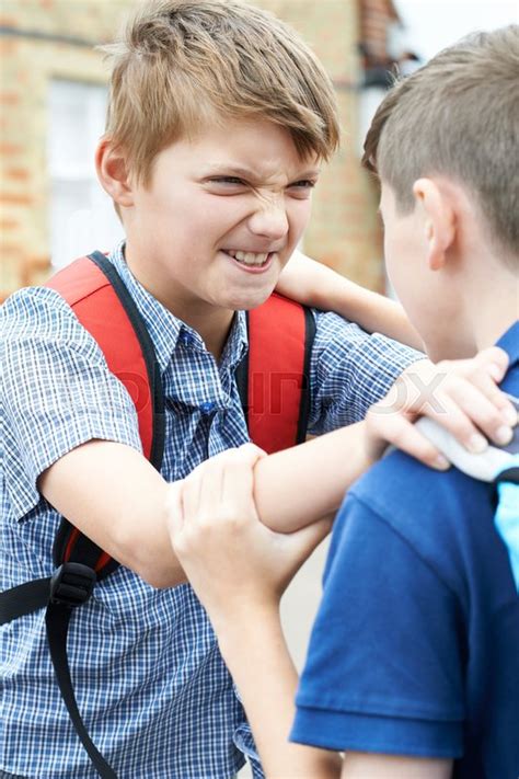 Two Boys Fighting In School Playground Stock Photo