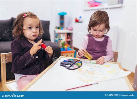Happy Little Girls Preschooler Painting With Water Color Selective