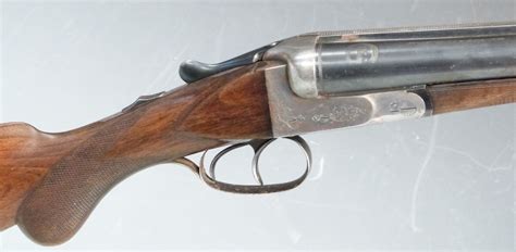 Geco 12 Bore Side By Side Shotgun With Engraved Lock Chequered Semi