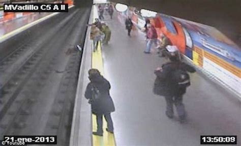 Woman Falls On Madrid Subway Tracks Police Officer Saves Her Life Foxcrawl