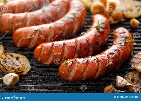 Grilled Sausages With The Addition Of Herbs And Vegetables On The Grill