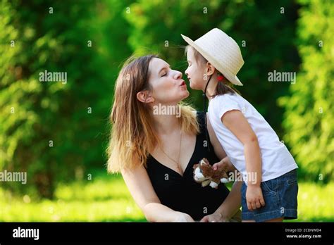 Mother Kisses Daughter Stock Photo Alamy