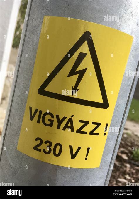 Yellow Vigyazz 230v ‘danger 230v Sign In Hungarian Hungary Stock
