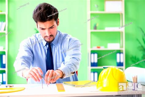 Young Male Architect Working At The Project Stock Photo Picture And