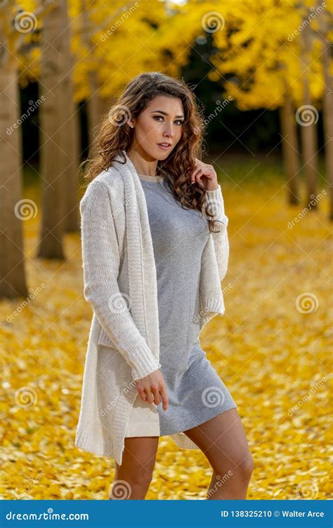 Brunette Model Enjoying A Fall Day In Fall Foliage Stock Photo Image