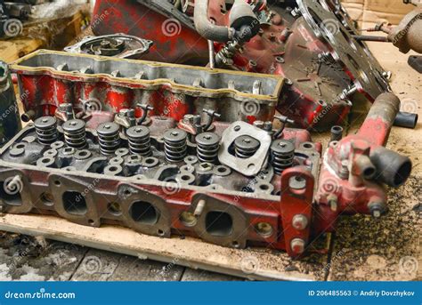 Exploded View Of The Cylinder Head Of A Four Cylinder Engine Being