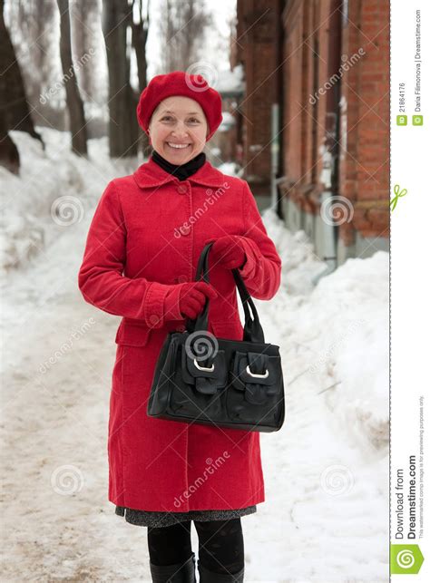 Woman In Wintry Clothes Walking Royalty Free Stock Image