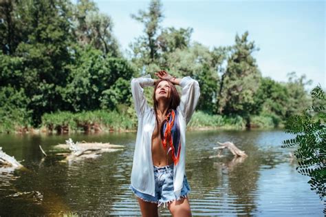 Premium Photo Sensual Sexy Brunette Girl In An Unbuttoned White Shirt