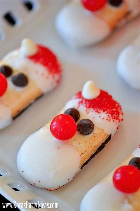 This cheese reindeer is made from laughing cow cheese wedge, pretzels, olive and red pepper. Amazing appetizer ideas for your next holiday party ...