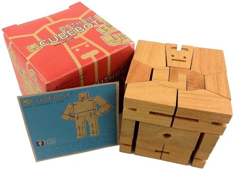 Drag and drop the wooden blocks to complete a vertical or horizontal line. Guthrie Cubebot - Wooden Brainteaser Puzzle