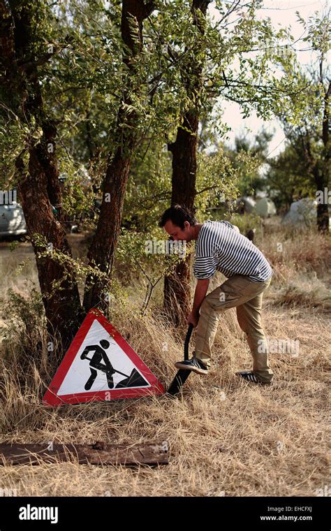 Man Digging Near The Sign Forbidden To Dig Stock Photo Alamy