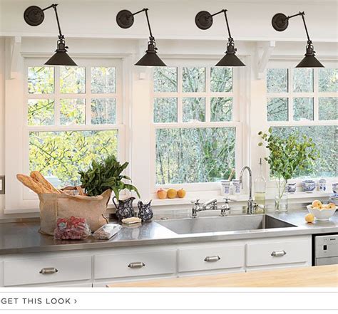 I mounted a light above the kitchen sink. library sconces over kitchen sink | Kitchen sink lighting ...