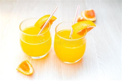 Some Orange Juice With Straw Into Glass For Breakfast Stock Photo