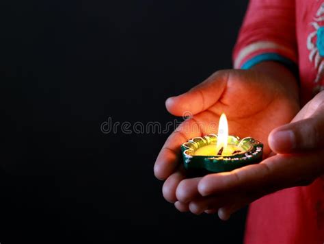 A Girl Holding Diya In Her Hand To Celebrate Diwali Stock Photo Image