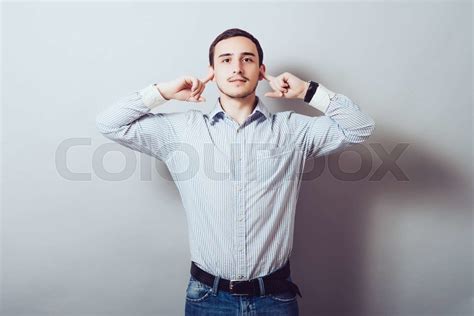 Man Covers His Ears From The Noise Stock Image Colourbox