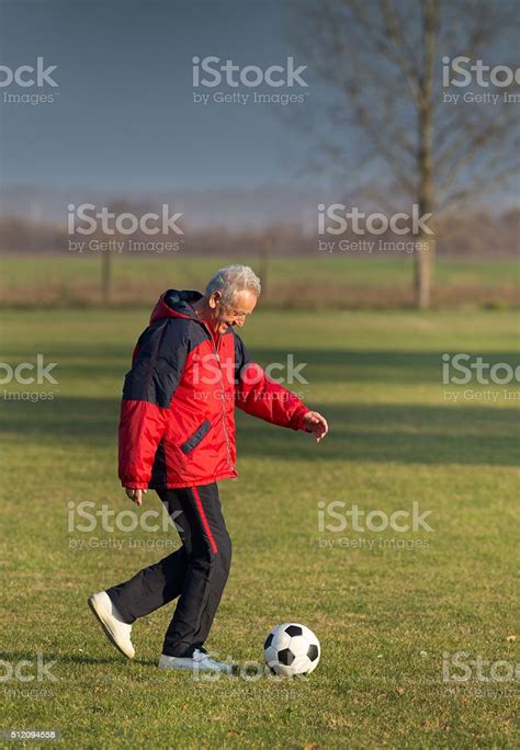 Old Man Playing Football Stock Photo Download Image Now 70 79 Years