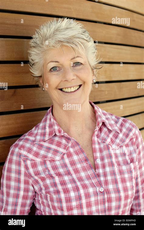 Attractive Mature Older Woman With A Healthy Happy Smile And Youthful