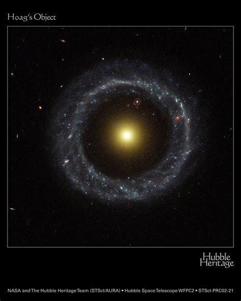 Ring Of Hot Blue Stars Pinwheels Around Yellow Nucleus Of Hoag S Object