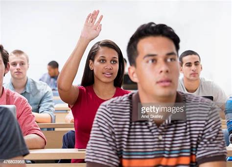African American College Student Raising Hand Photos And Premium High