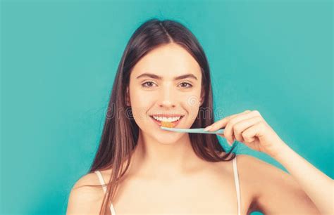 Smiling Young Woman With Healthy Teeth Holding A Tooth Brush Young