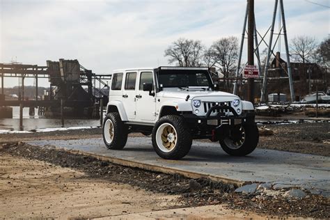 Lifted Jeep Wrangler Jk Rolling On Gold Fuel Rims With Colormatched