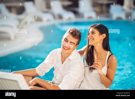 Loving Couple Spending Vacation On Tropical Resort Swimming Poolnewlyweds Honeymoon On Seaside