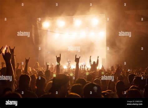 Silhouettes Of Concert Crowd In Front Of Bright Stage Lights Rock And