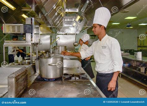 Professional Chef Cooking At The Kitchen Of The Restaurant Editorial