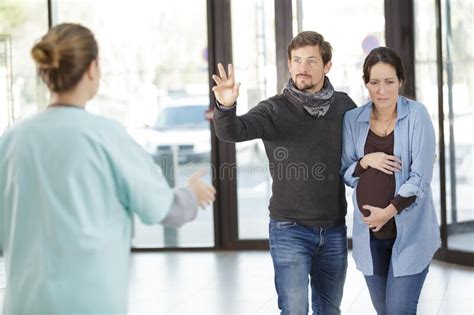 Pregnant Woman Suffering And Husband Calling Doctor In Hospital Stock Image Image Of Support