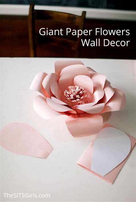 Adding feathers and fresh heather from the garden create a hello, it looks like they drilled a little hole into the large stick and glued in each little flower, then attached the large stick with flowers to the wall. Perfect for bringing spring inside any time of the year ...
