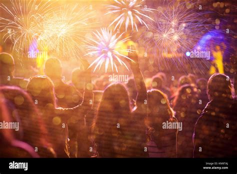 Cheering Crowd Watching Fireworks At New Year Stock Photo Alamy