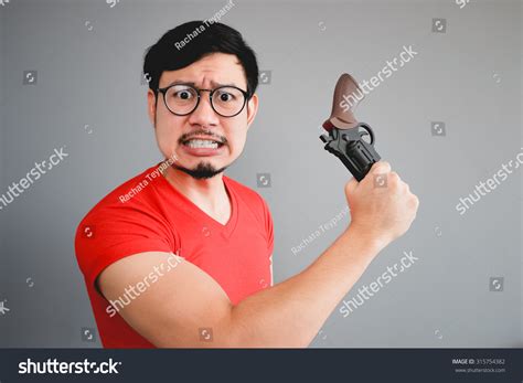 Asian Man Holding Gun Stock Photo 315754382 Shutterstock