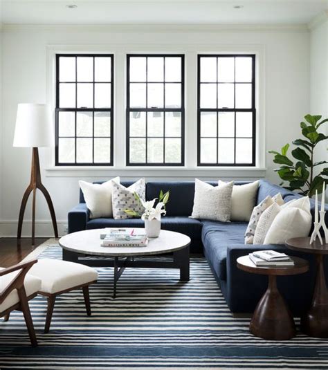 Black Trimmed Windows White Walls Striped Rug Navy Blue Sectional