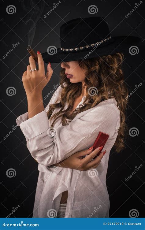 Portrait Of Elegant Lady Woman With Hat Smoking Cigar Stock Photo