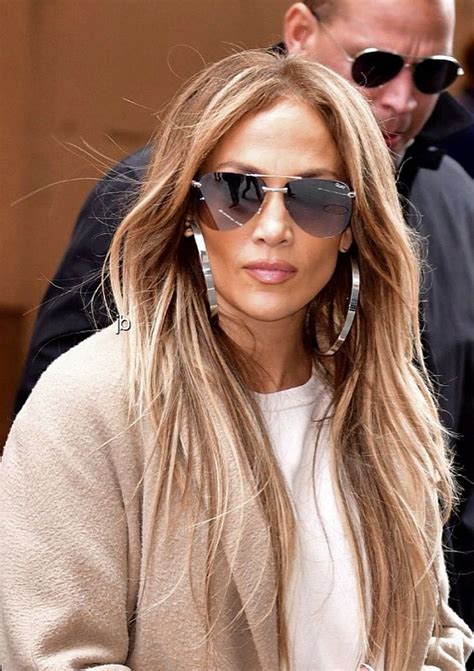Jennifer Lopez Wearing Black Aviator Sunglasses And Extra Large Silver
