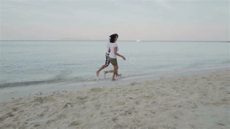 Happy Man And Woman Playing In The Sea On The Exotic Beach Stock Video Video Of Sunset Coast