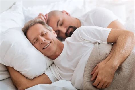 Gay Couple Sleeping Together On Bed — Stock Photo © Wavebreakmedia