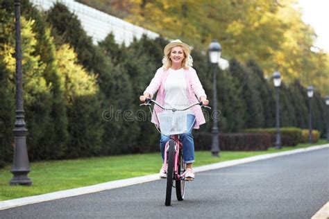 Mature Woman Riding Bicycle Active Lifestyle Stock Image Image Of Outdoors Attractive